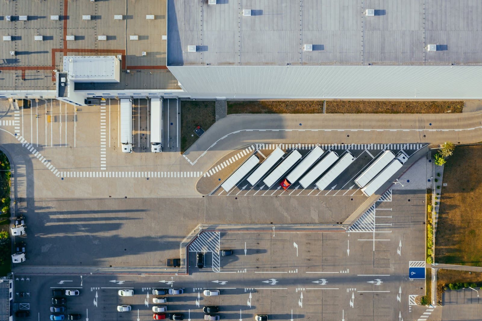 Aerial view of trailers backed into loading dock doors at a distribution centre